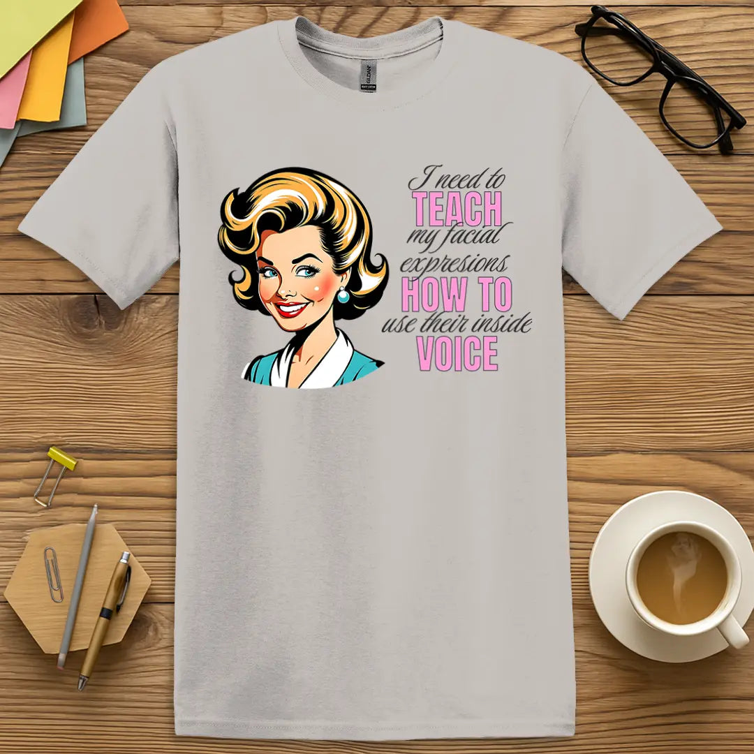 Ice Grey Color T-shirt with "I need to teach my facial expressions how to use their inside voice" design featuring clean tones and snarky teacher humor.