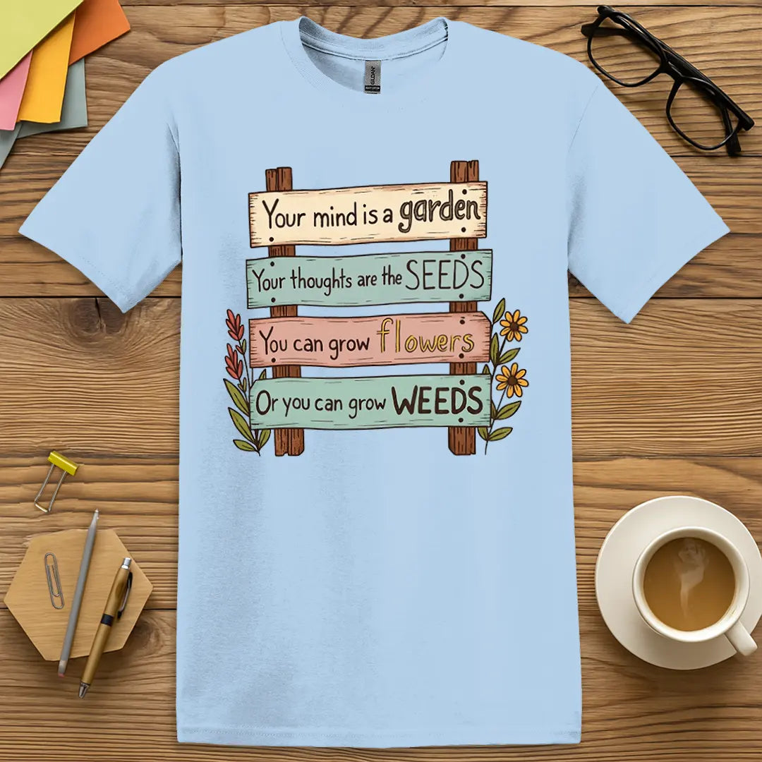 Light Blue Color T-shirt with "Your mind is a garden..." design featuring bright mindset messaging with quirky flower accents.