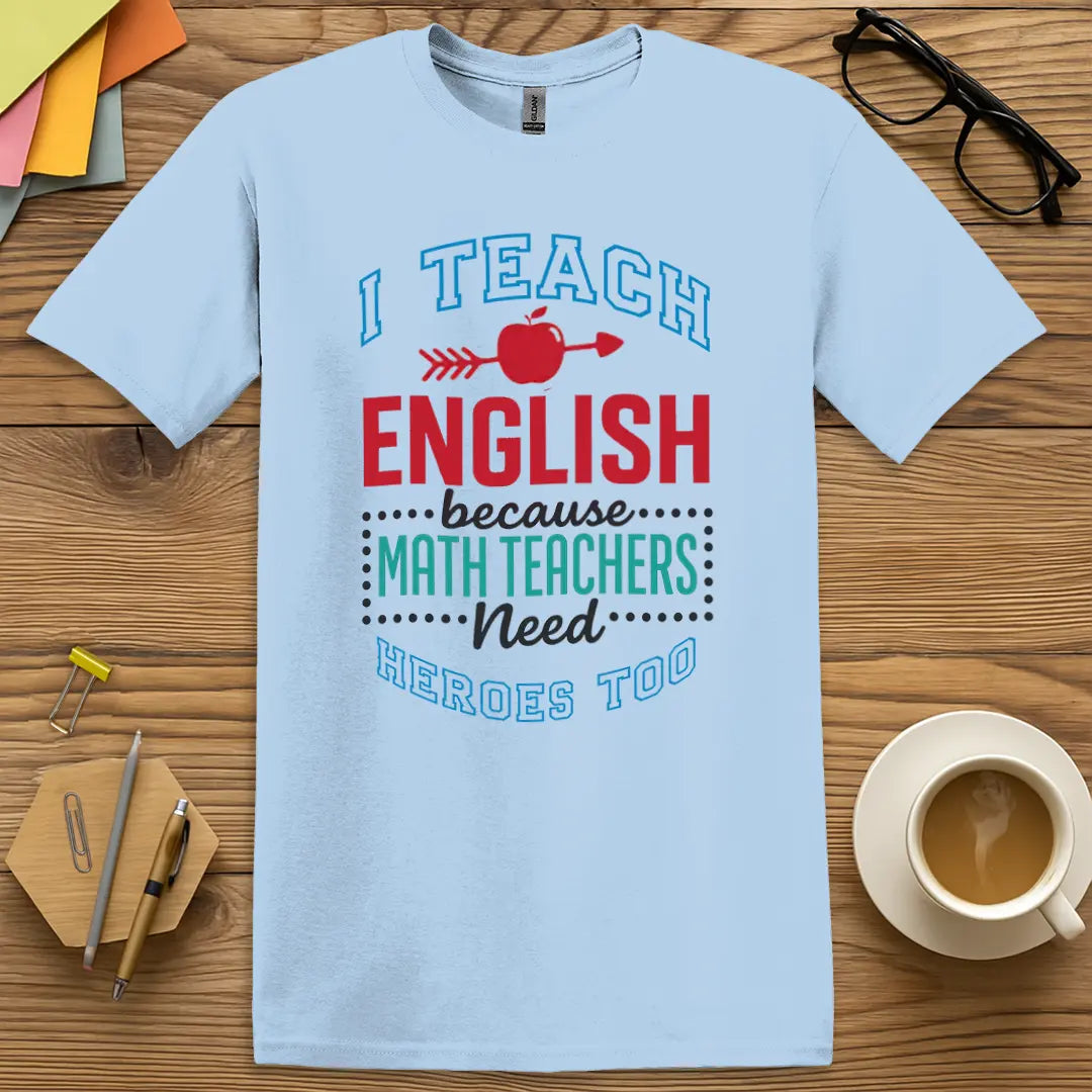 Light Blue T-shirt with "I Teach English because Math Teachers Need Heroes Too" design adding calm color with red-pen hero charm.