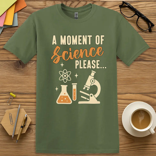 Military Green T-shirt with "A Moment of Science Please..." design featuring lab icons and clever science pun.