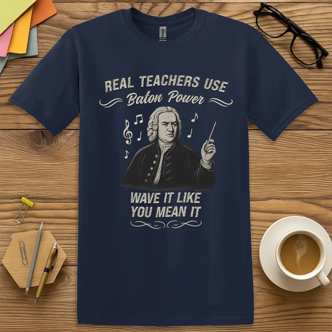 Navy Color T-shirt with "Real Teachers Use Baton Power - Wave It Like You Mean It" design mixing academic sass and musical authority.