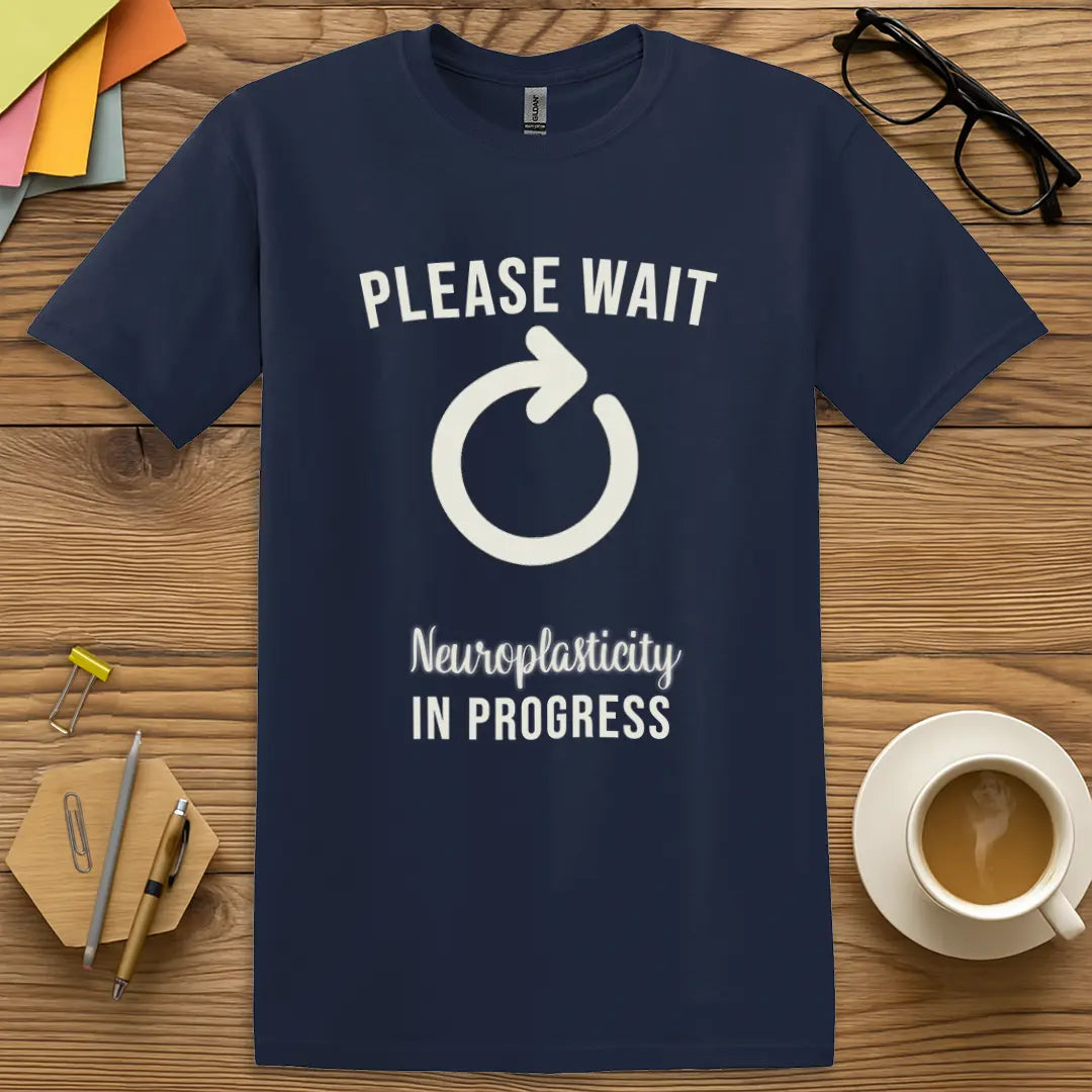 Navy Color T-Shirt with "Please Wait Neuroplasticity In Progress" design mixing deep tone and cognitive science sass.