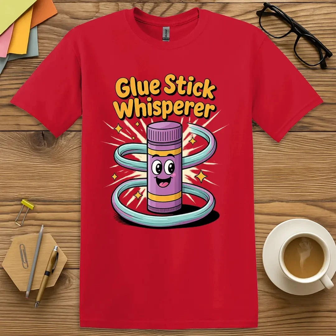 Red Glue Stick Whisperer T-Shirt – Bold and playful tee for educators who keep creativity flowing and classroom supplies under control.