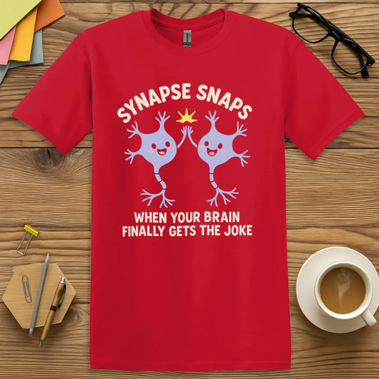 Red Color T-shirt with "Synapse Snaps: When Your Brain Finally Gets the Joke" design featuring smiling neurons high-fiving in bright, playful style.