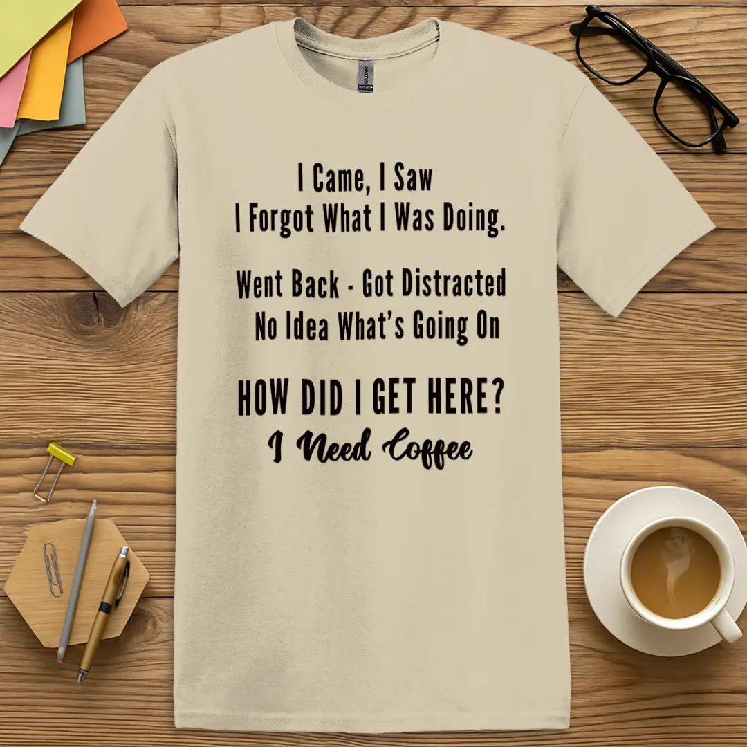 Sand T-shirt with "How Did I Get Here? I Need Coffee" design with a soft, relatable vibe perfect for exhausted educators.