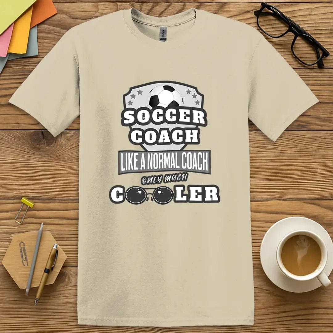 Sand T-shirt with “Soccer Coach” design featuring relaxed, earthy tones and strong team-leading energy