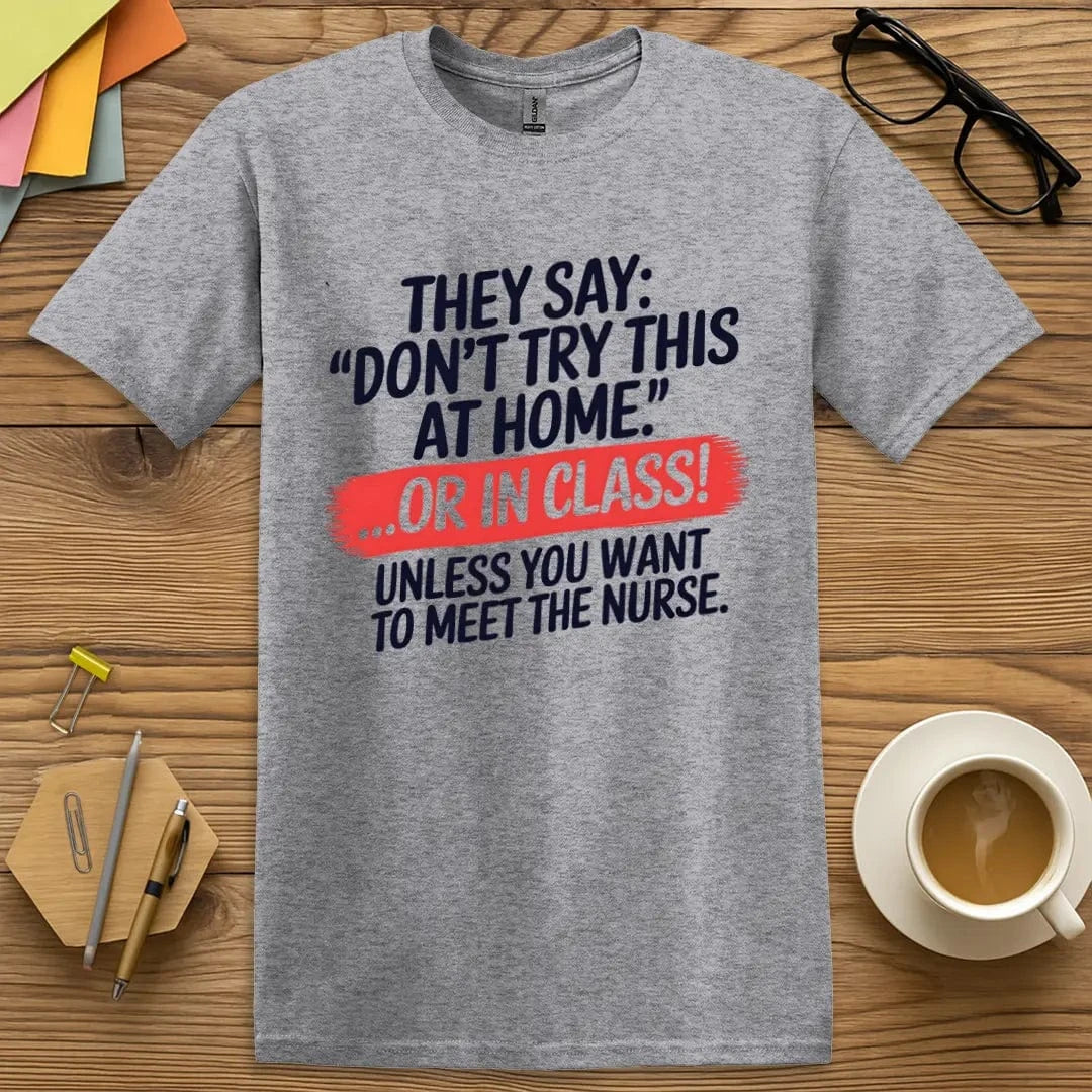 Sport Grey T-shirt with “Don’t Try This at Home... OR IN CLASS!” design featuring bold safety-themed humor and playful educational warning