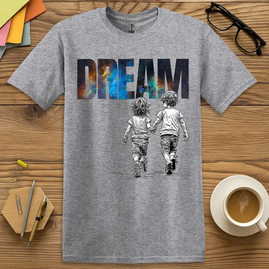 Sport Grey T-shirt with “DREAM” design featuring galaxy text and sketched children walking hand-in-hand toward imagination