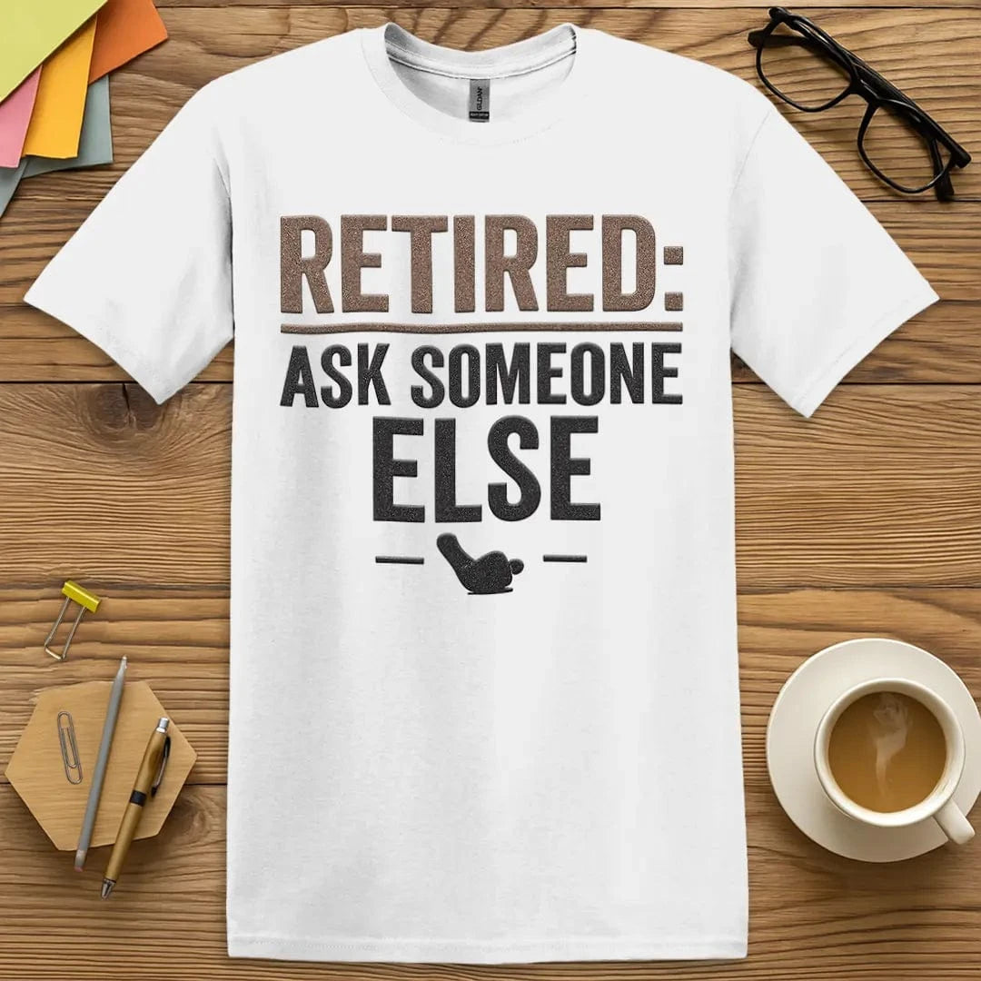 White T-shirt with “Retired: Ask Someone Else” design featuring bold classroom humor and passive-aggressive charm